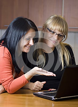 Two women on laptop