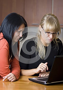 Two women on laptop