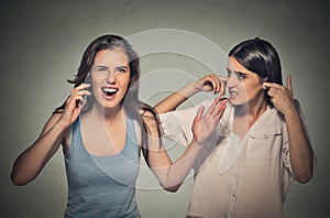 Two women loud, obnoxious rude woman talking loudly on cell phone
