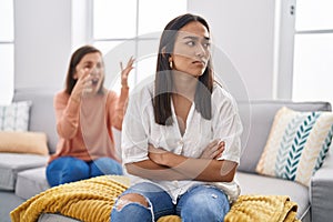 Two women mother and daughter arguing at home