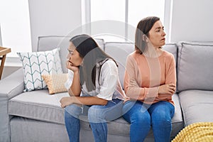 Two women mother and daughter arguing at home