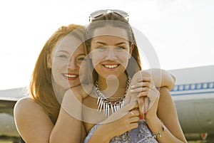 Two women mother and daughter met at the airport after trip