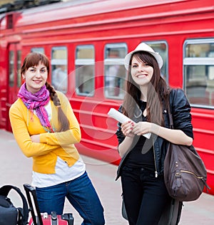 Two women are near the train