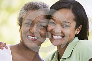 Two women outdoors smiling