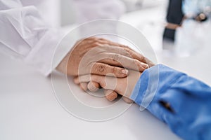 Two women pharmacist and customer with hands together at pharmacy