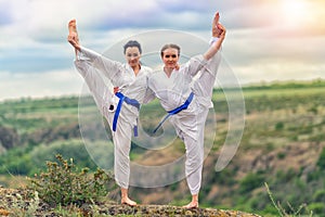 Two women practicing yoga together