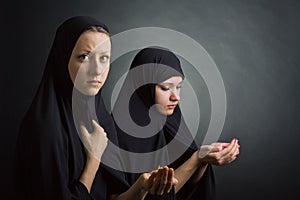 Two women pray