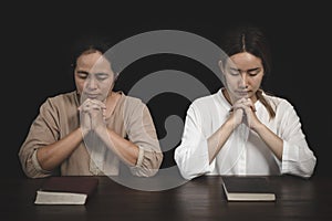 Two women are praying for God`s blessing. The idea of praying to the Lord with patience and steadfastness. May God strengthen you
