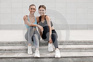 Two women relaxing after training outdoor