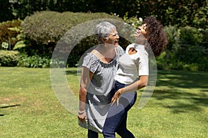 Two women smiling in the garden