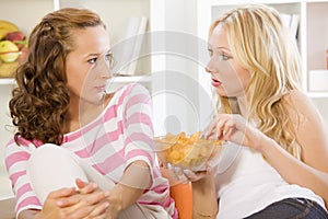 Two women on sofa talking