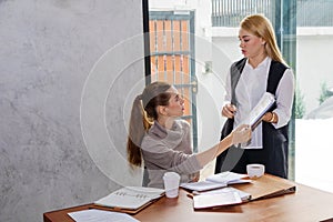 Two women are studying and teaching