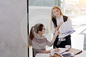 Two women are studying and teaching