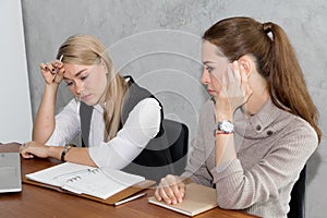 Two women are studying and teaching