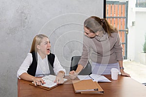 Two women are studying and teaching
