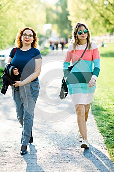 Two women walking along the waterfront