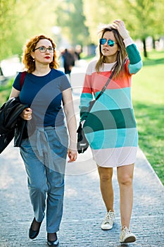 Two women walking together - having rest time