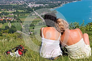 Two women watching view of Lake Annecy