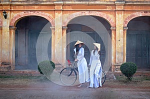 Two women wearing the Ao Dai Vietnam traditional