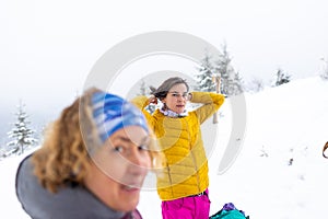 Two women in winter trekking in mountains