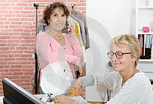 Two women work in a sewing workshop