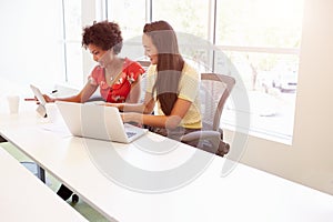 Two Women Working Together In Design Studio