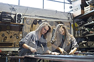 two women working in workshop