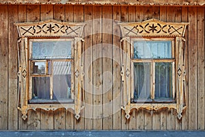 Two wood ornate windows in russian old style