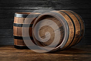 Two wooden barrels on table