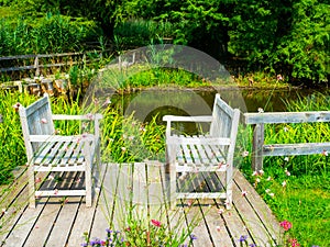 Two wooden benches in colorful garden