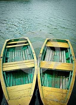 Two wooden boats berth