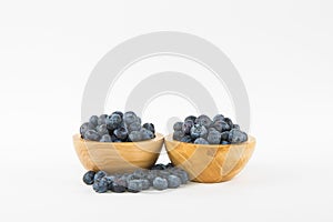 Two Wooden Bowls of Blueberries