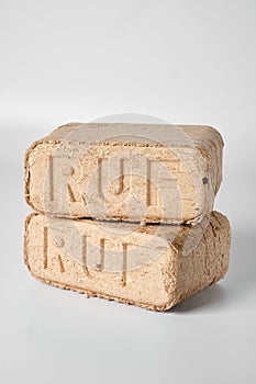 Two wooden briquettes ruf type on white background