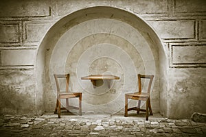 Two wooden chairs and table