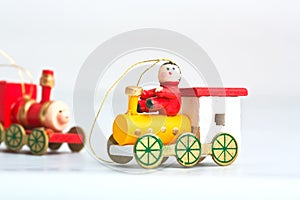 Two wooden christmas toy locomotives