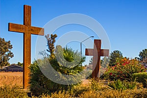 Two Wooden Crosses Against Blue Sky Background