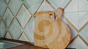 Two wooden handmade craft cutting boards on kitchen