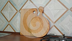 Two wooden handmade craft cutting boards on kitchen