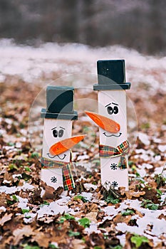 Two wooden snowmen