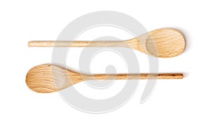 Two wooden spoons on the white background