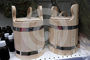 Two wooden tubs on a shelf