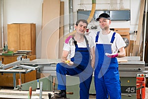 Two worker in a carpenter's workshop