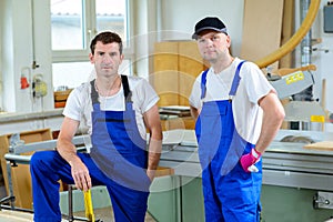 Two worker in a carpenter's workshop