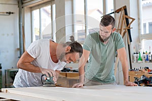 Two worker in a carpenters workshop
