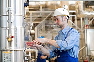 Two worker with helmet ,ear protector and goggles