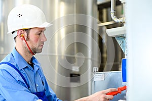 Two worker with helmet ,ear protector and goggles