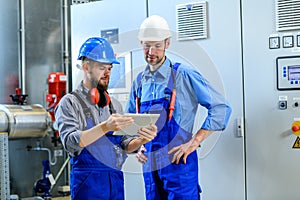 Two worker in industrial plant