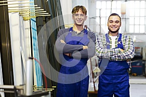 Two workers in coveralls