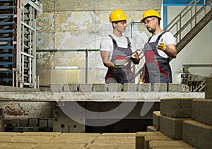 Two workers on a factory