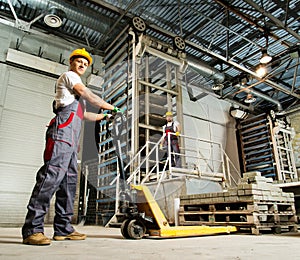 Two workers on a factory